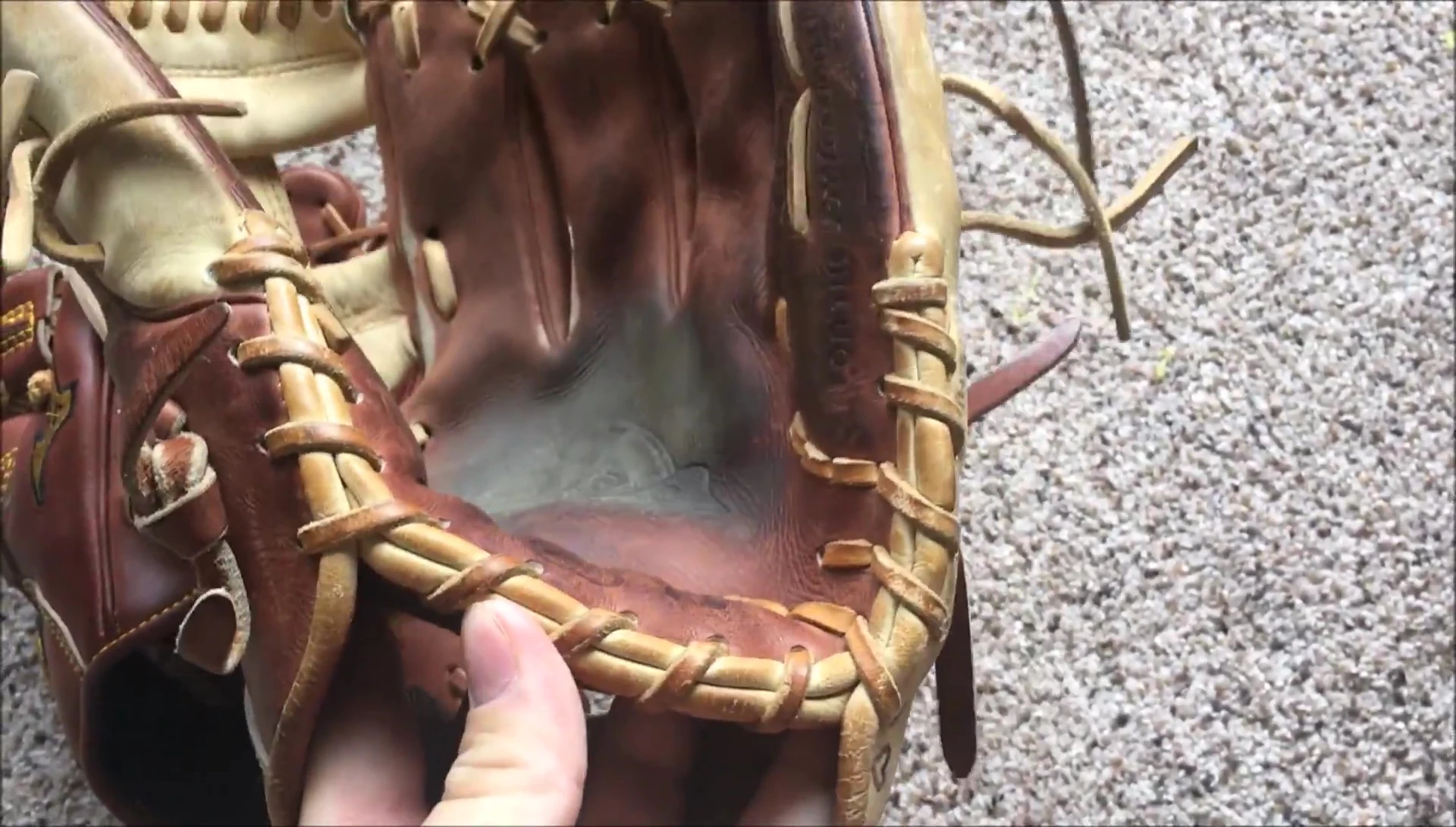 Rawlings glove after heel pad modification, showcasing flexibility.