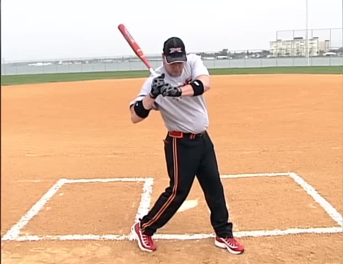 Keep your hands back, holding the bat head back.