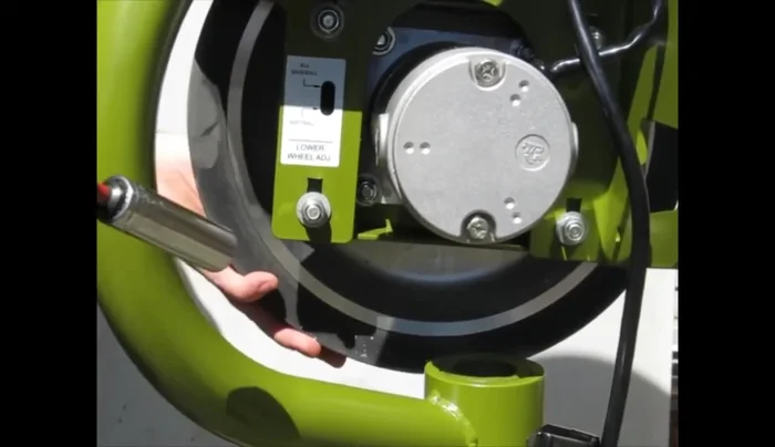 Bring the motor mount all the way to the top of the four slots, hold it in place, and tighten all four nuts.