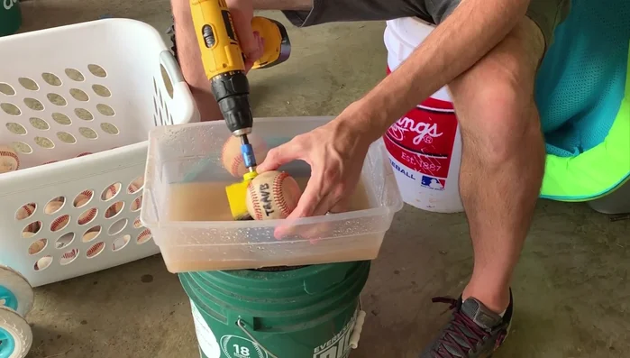 Repeat on the other side, pinching the ball from the opposite side.