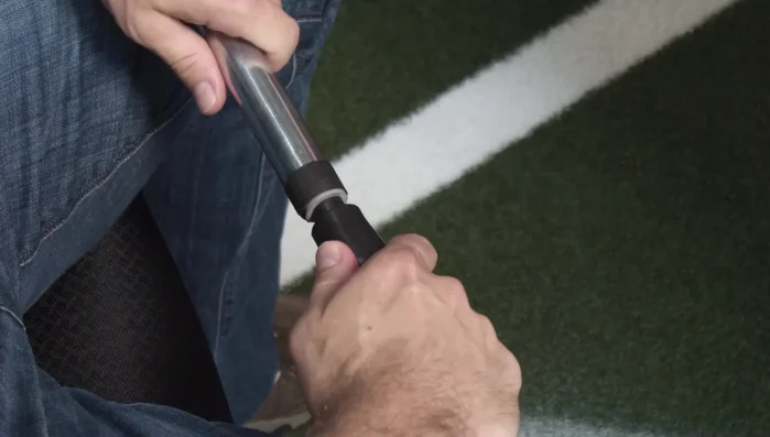 Push the rubber tip over the gray ring and tape, using your hands and twisting in the same direction as adhesive application. Push and twist several times to get it flush.