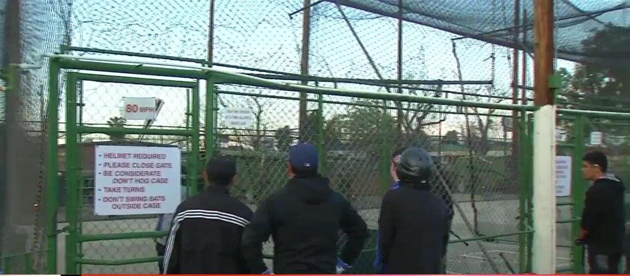 A father and son practicing batting.