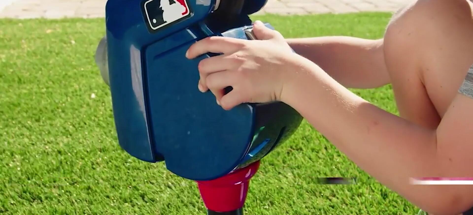 Close-up of the Franklin Sports pitching machine in action