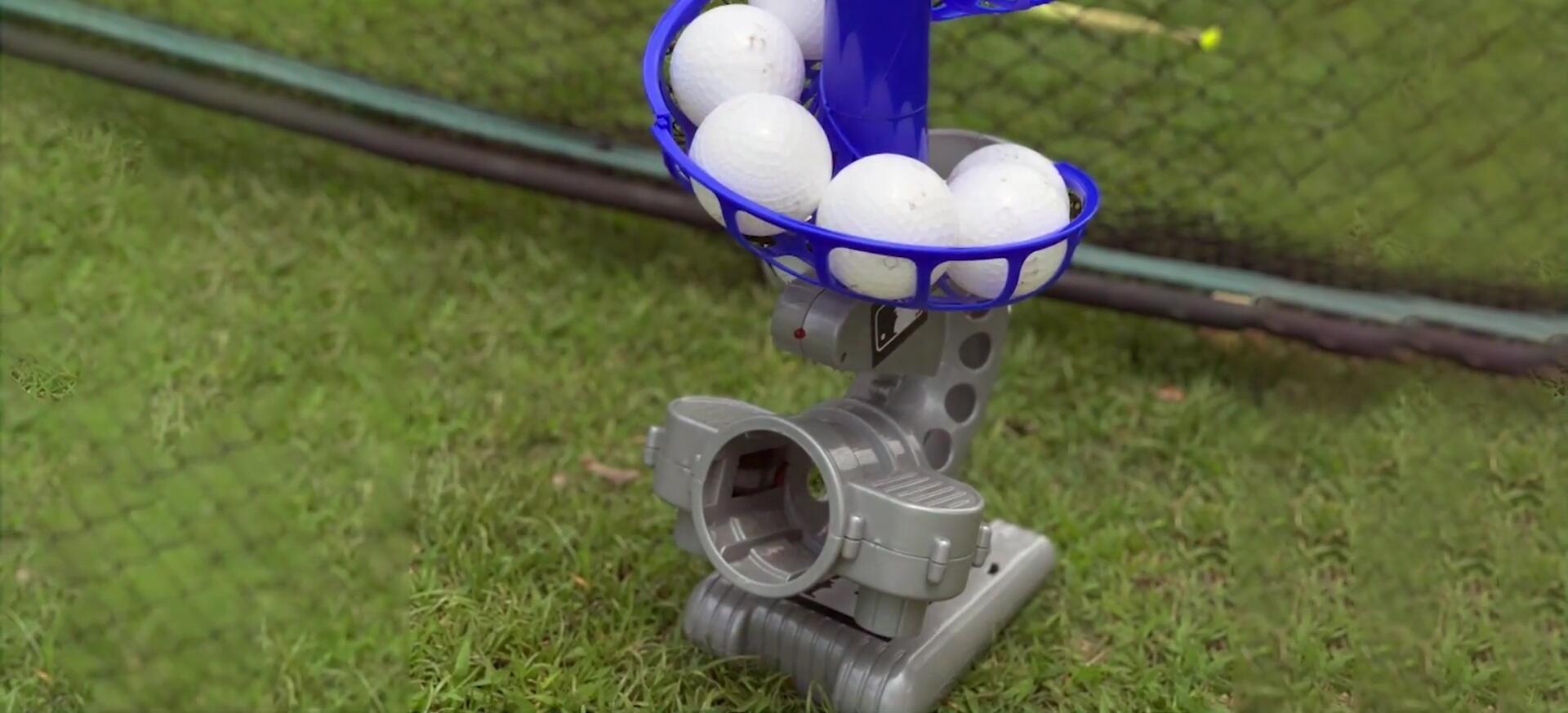 Child practicing with the Franklin Sports pitching machine