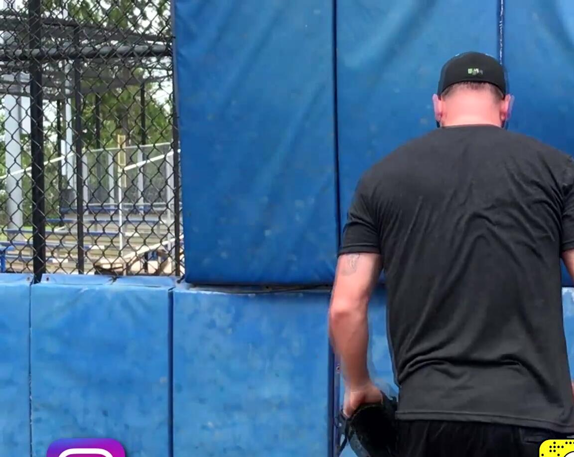 Demonstration of various weighted ball exercises