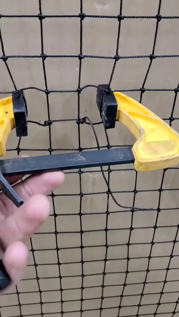 Trim the excess string close to the knots.