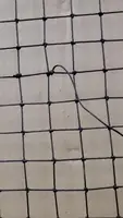 Repairing a Damaged Fishing Net: The Double Fisherman's Knot Method