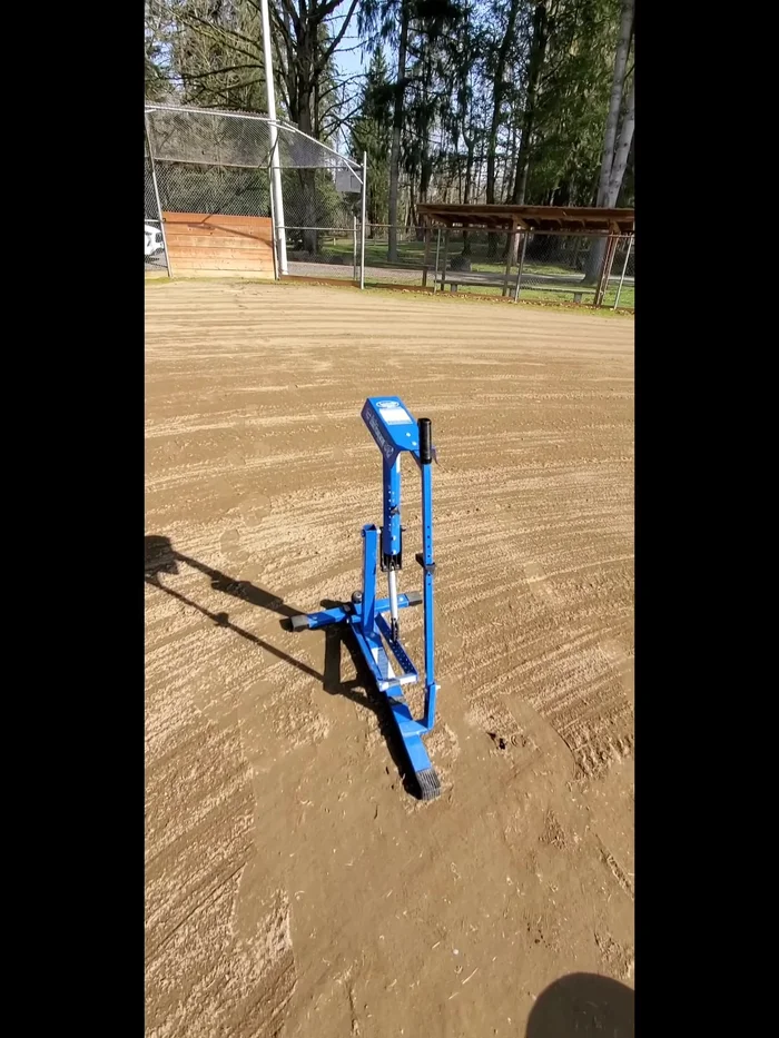 Secure the Machine: Tie the pitching machine to the pole next to the garbage cans.