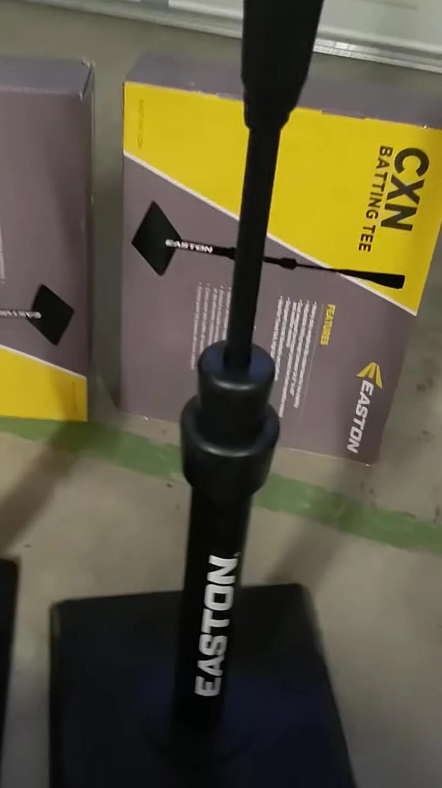 The presenter easily assembling another batting tee