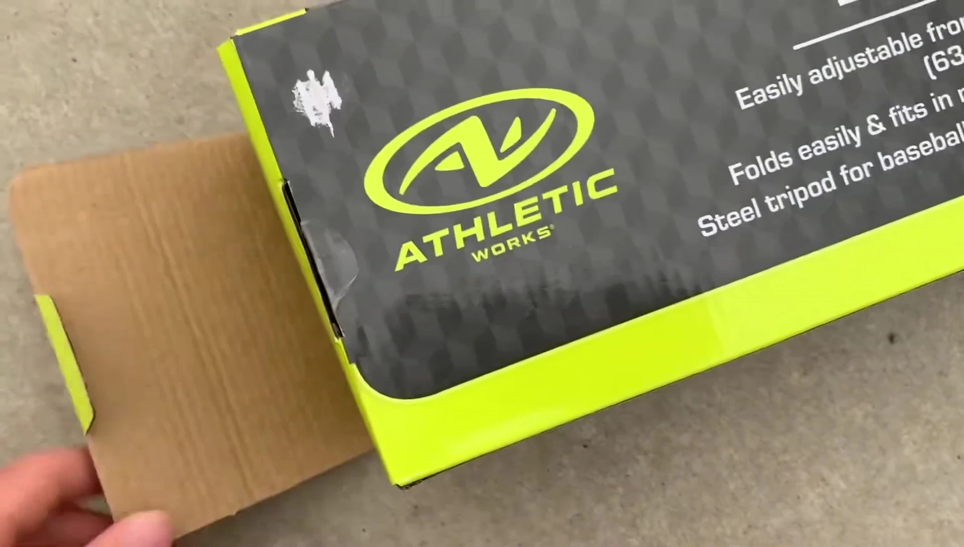 The $10 batting tee components laid out after opening the package.
