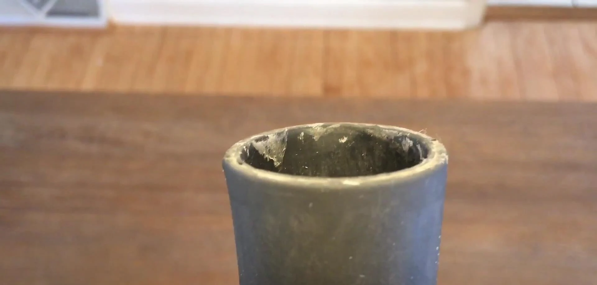 Mid-test inspection of the Rukket batting tee showing minimal wear
