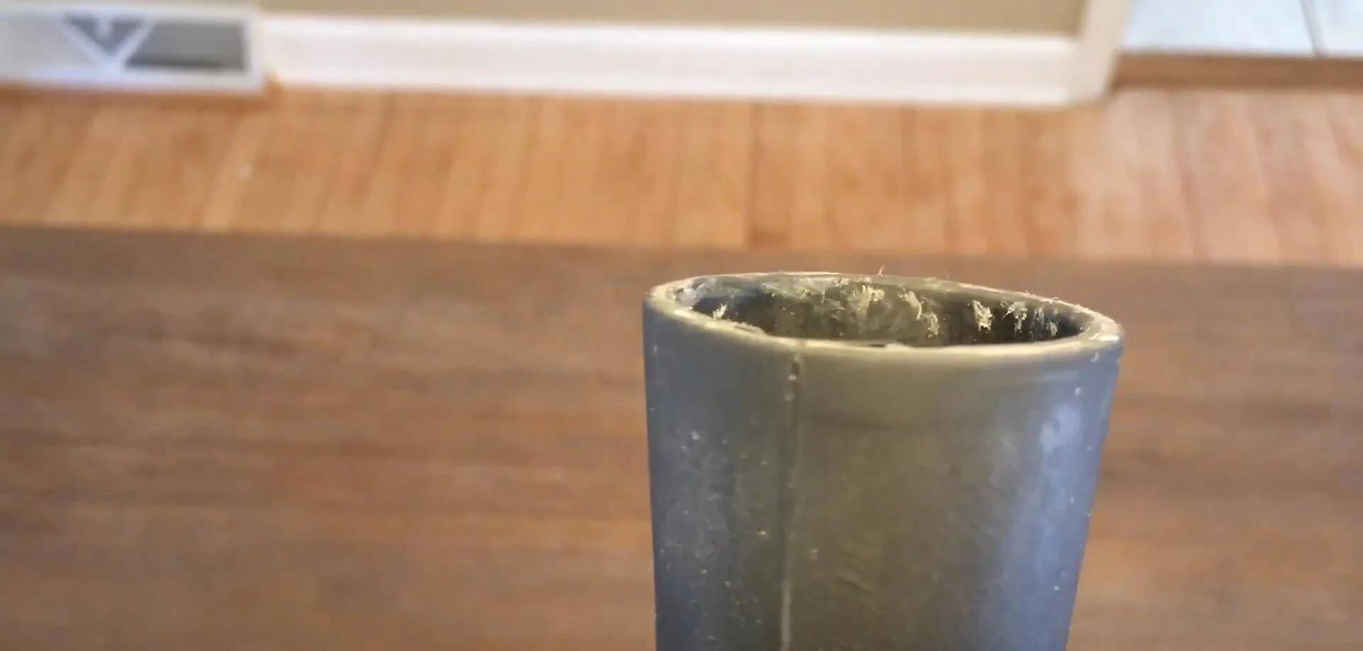 Close-up of the Rukket batting tee showcasing its condition after thousands of swings