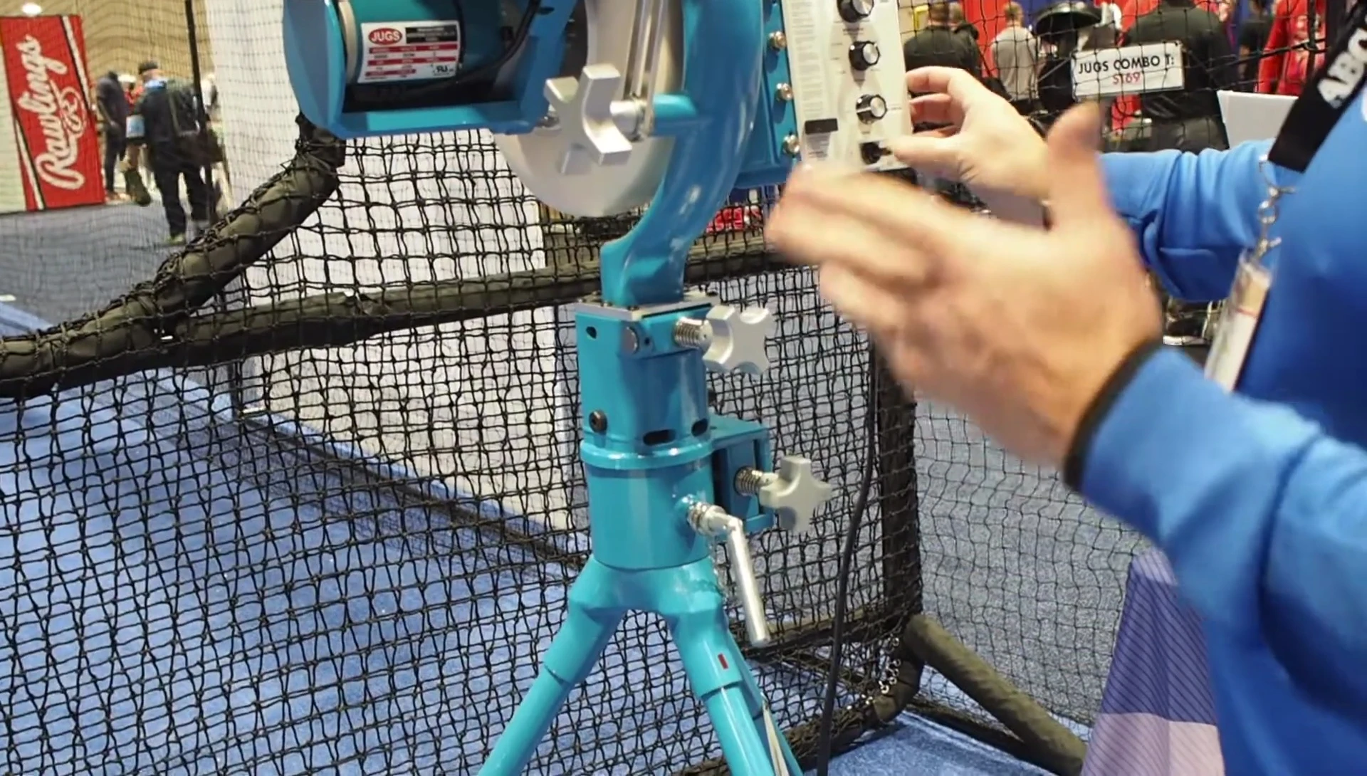 Demonstration of tilting and rolling the machine for transport.