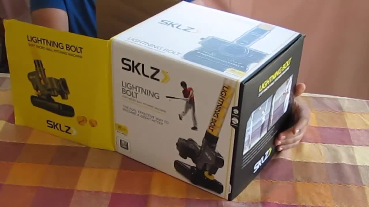 Close-up of the small pitching machine