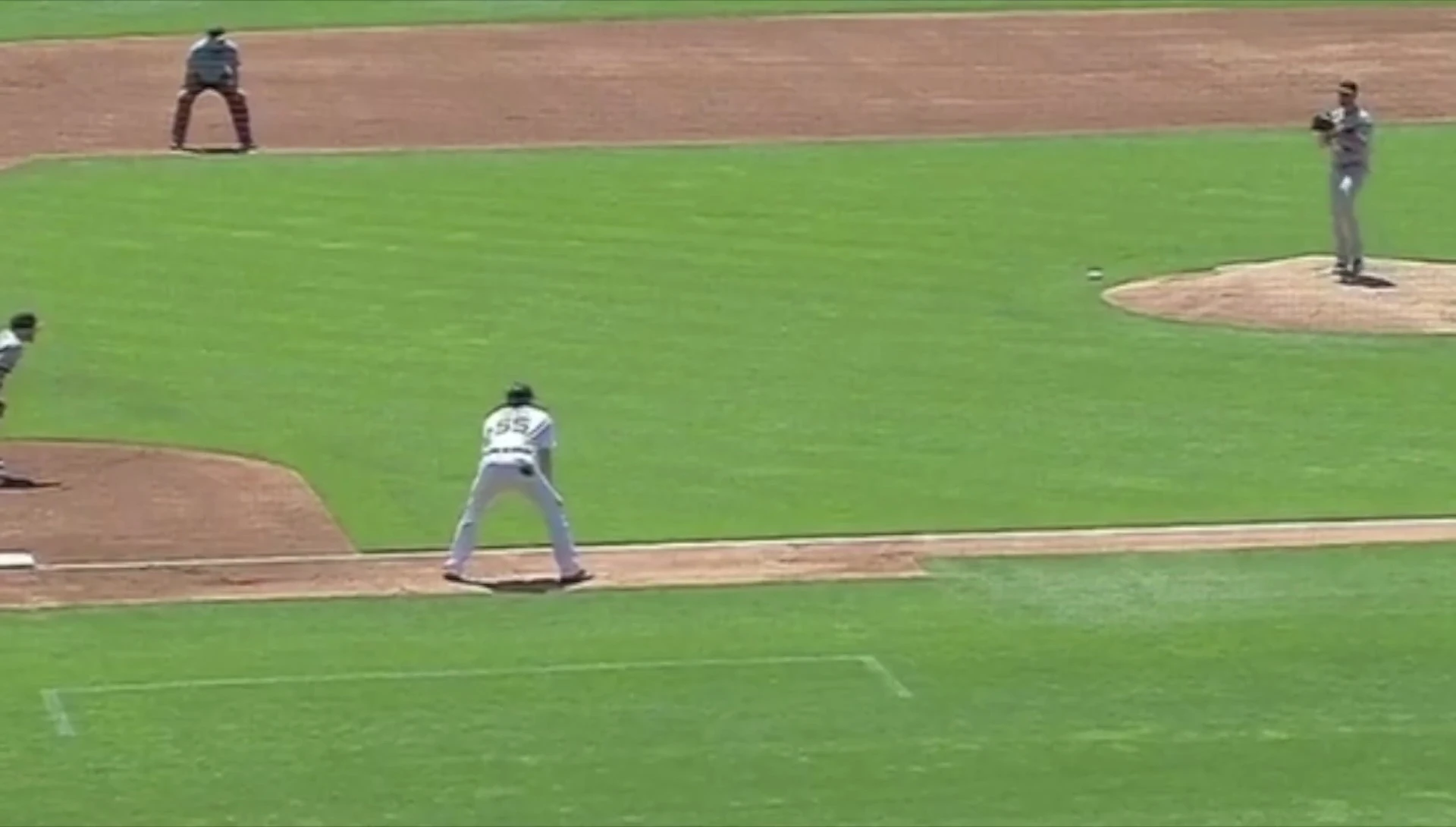 The third baseman's positioning near the bag.
