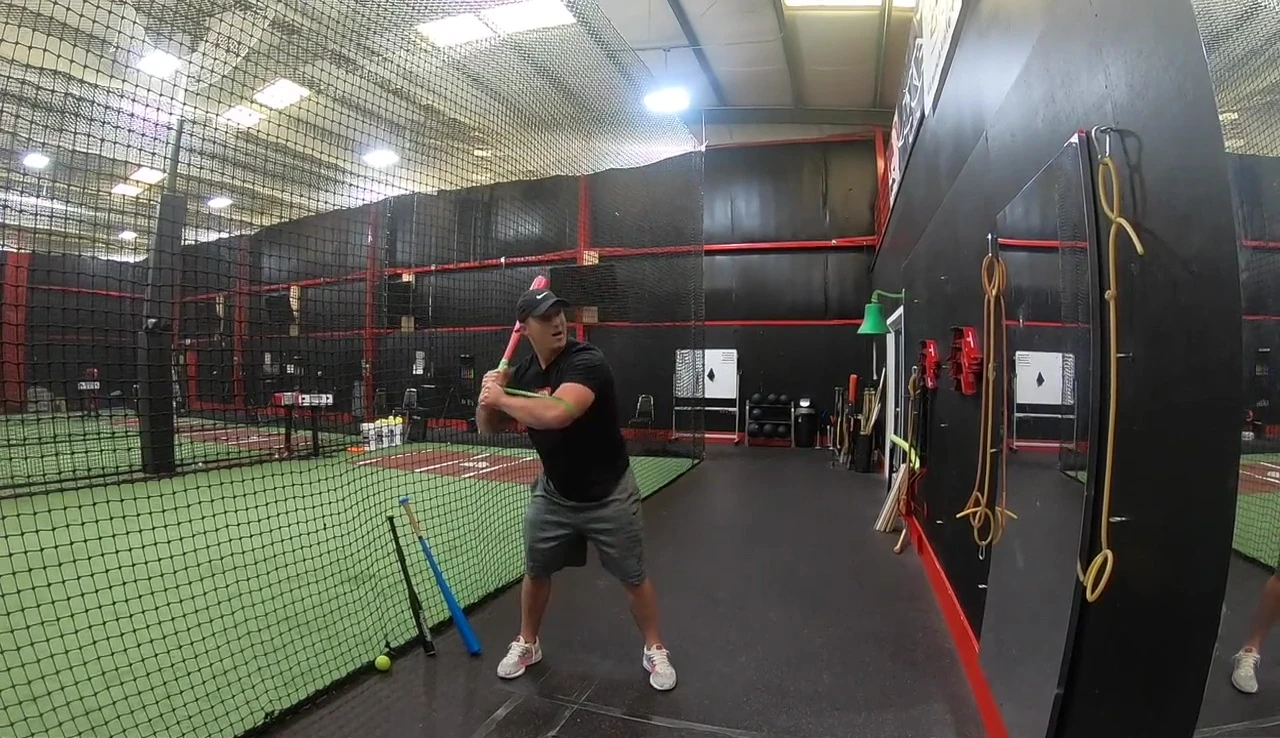 Player demonstrating the correct arm bar technique and body rotation with the band.