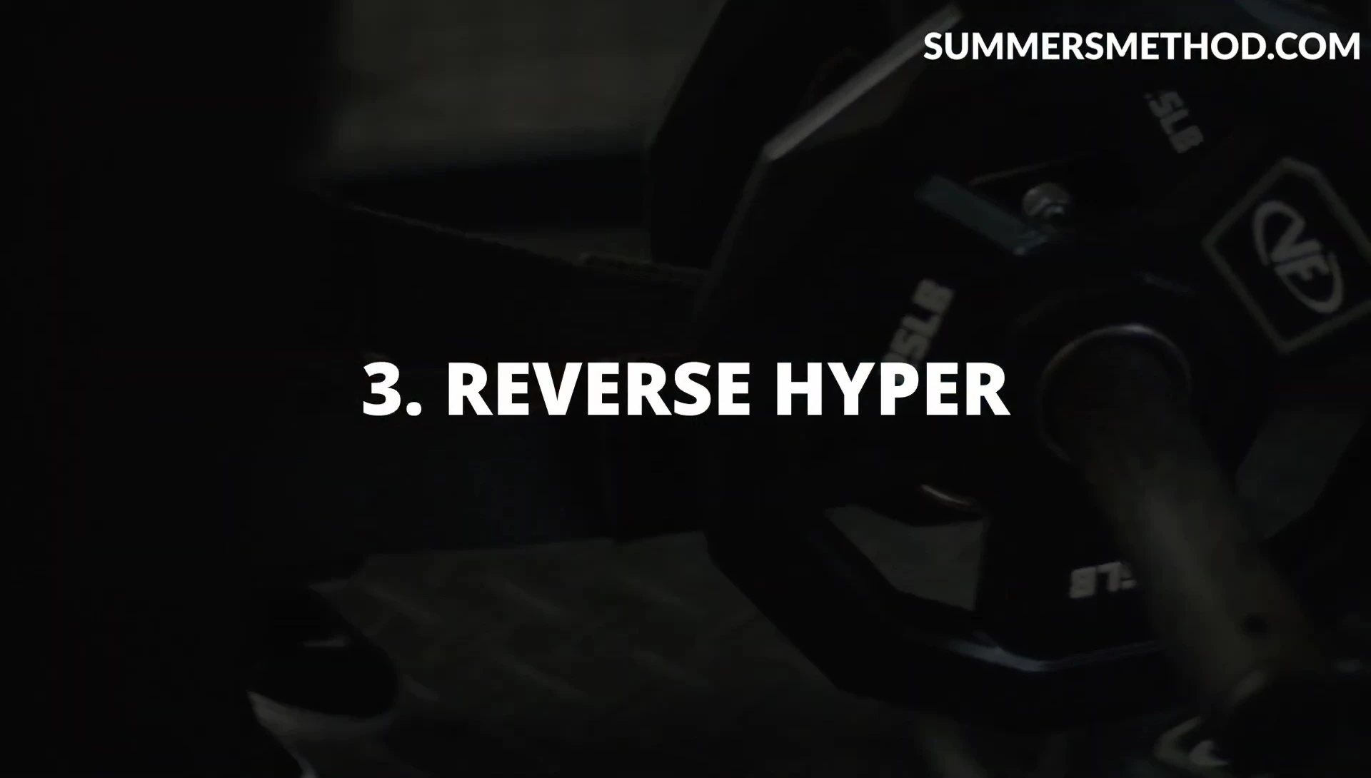 Athlete using a reverse hyper machine.