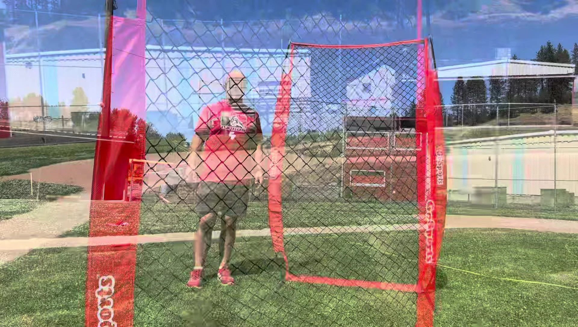 The coach standing behind the I-screen to demonstrate its height and coverage.