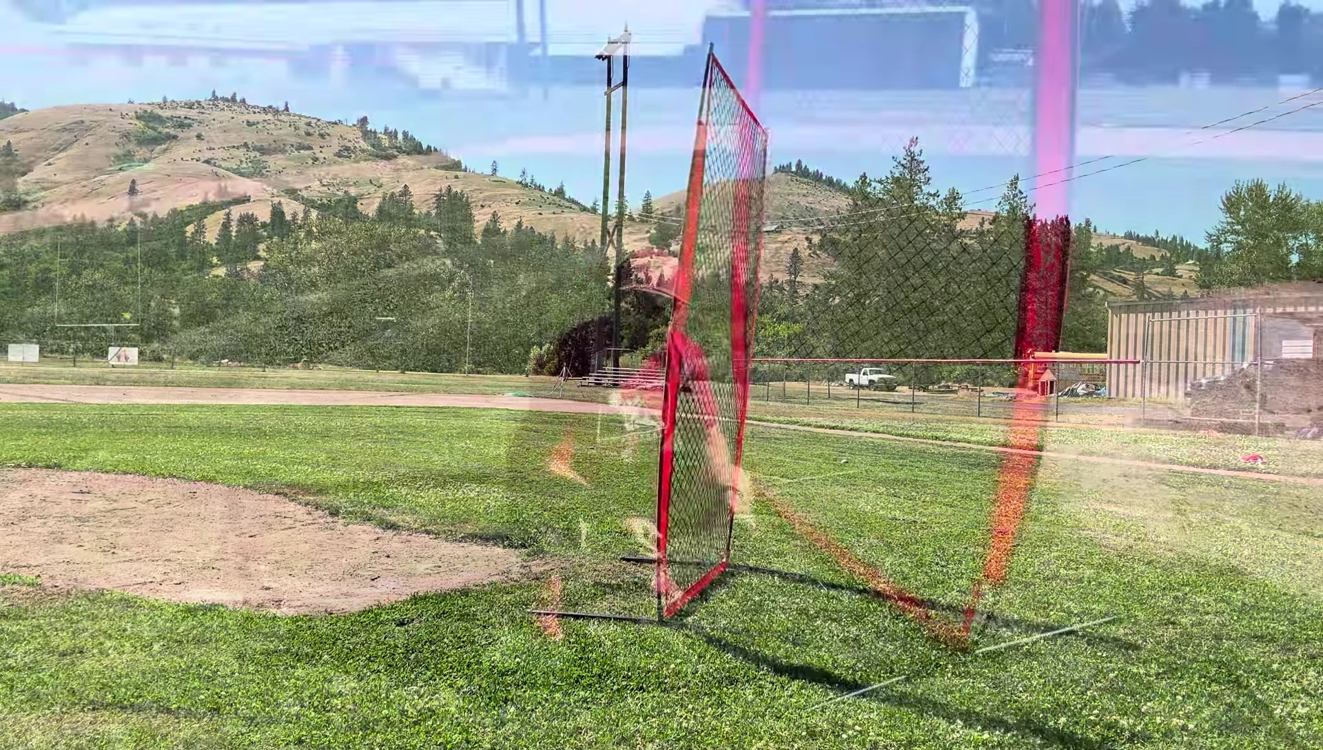 Securing the I-screen with stakes.