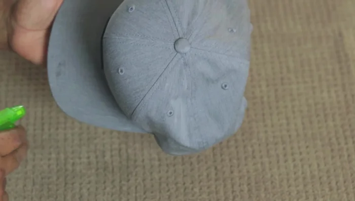 Wipe away residue with a wet washcloth. Squeeze clean water onto the cap and wipe again.