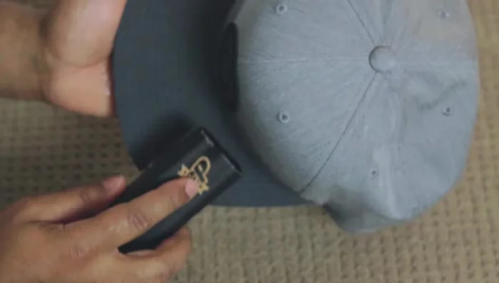 Wipe away residue with a wet washcloth. Squeeze clean water onto the cap and wipe again.