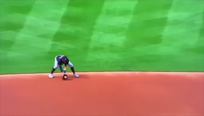 Funneling and Grip: Funnel the ball to the middle of your body, bringing your elbows out and thumbs up. This secure grip enables a smooth transfer to the throw.