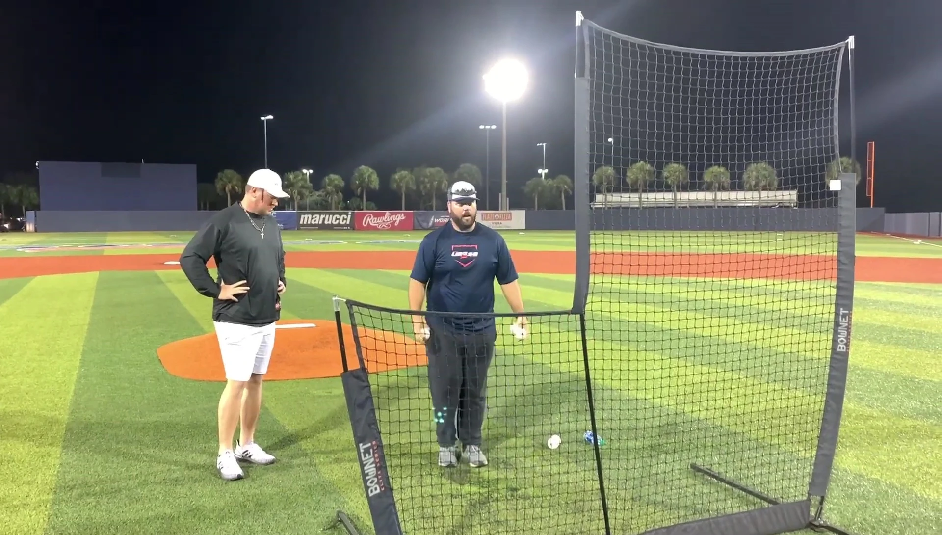 Coach illustrating the proper footwork in order to generate a consistent throwing motion.