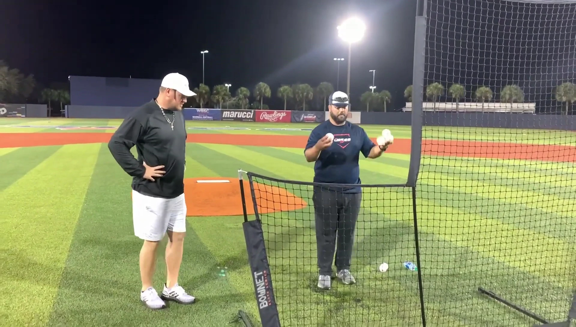 Coach demonstrating his pivot and throwing motion.