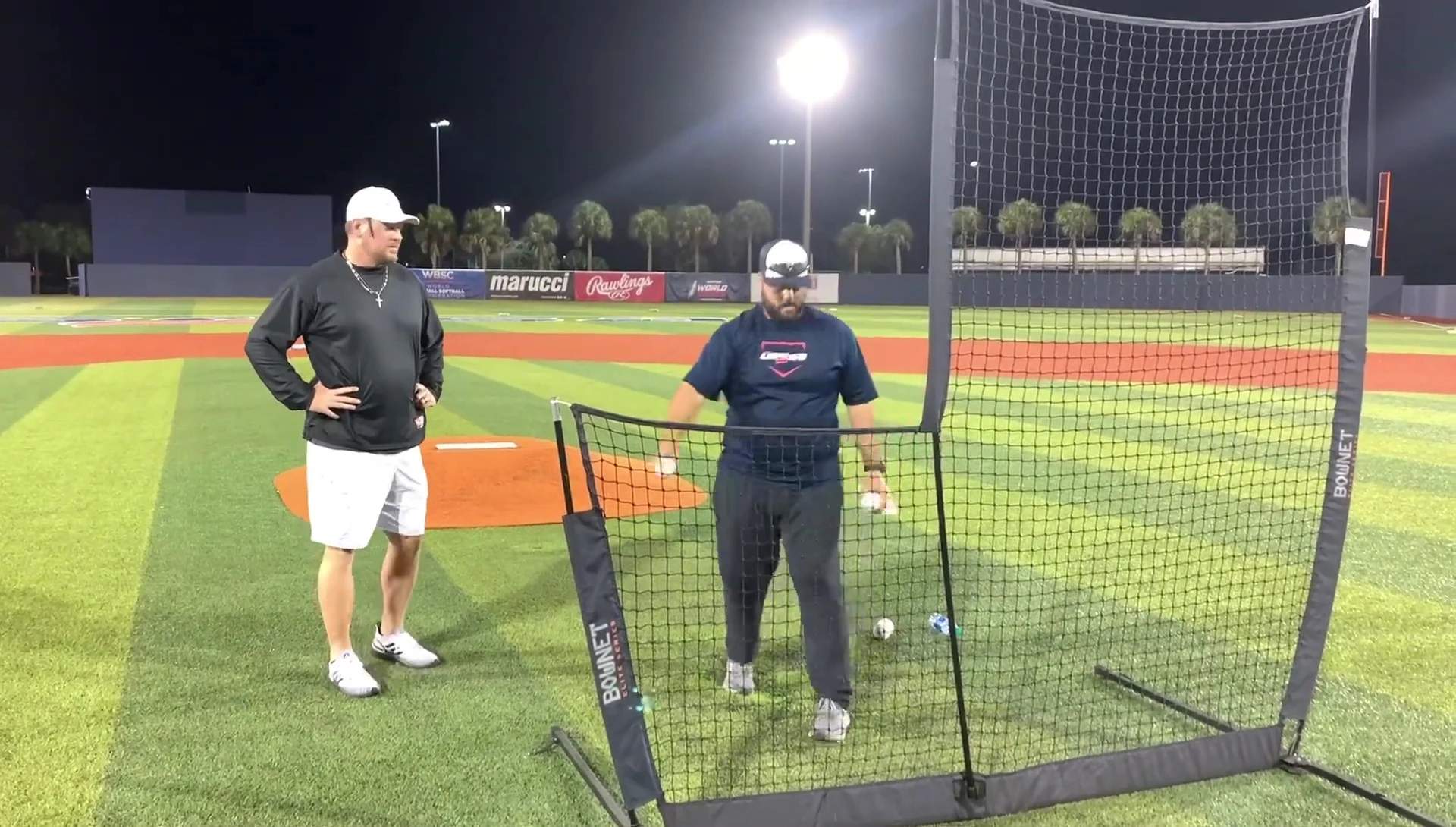 Close-up of the coach's consistent throwing motion.