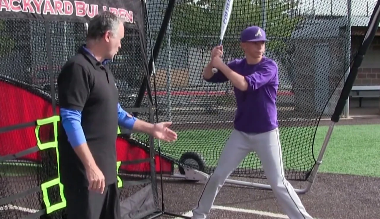Batter demonstrating the backward loading motion