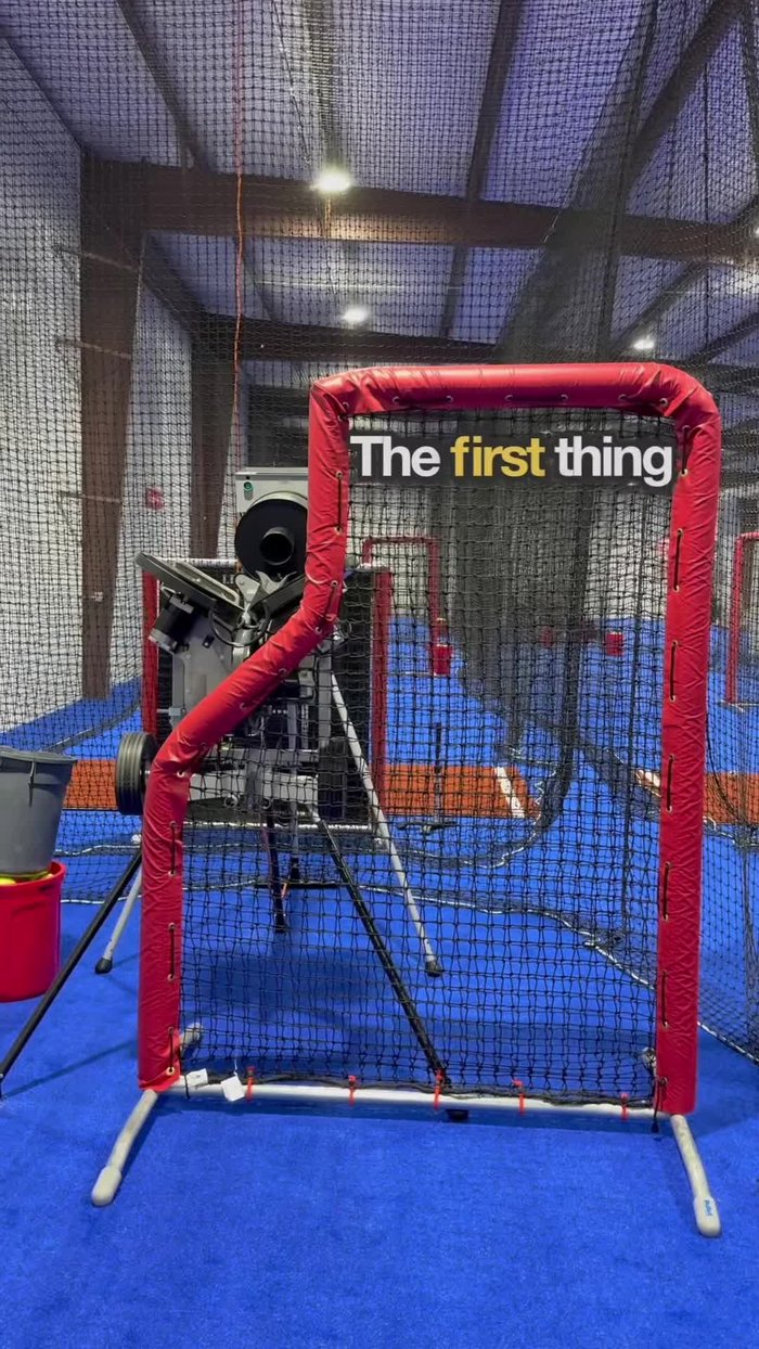 Turn the pitching machine on. Set the bottom wheel two numbers higher than the top wheel (e.g., 3 and 5) to achieve optimal backspin for ball flight.