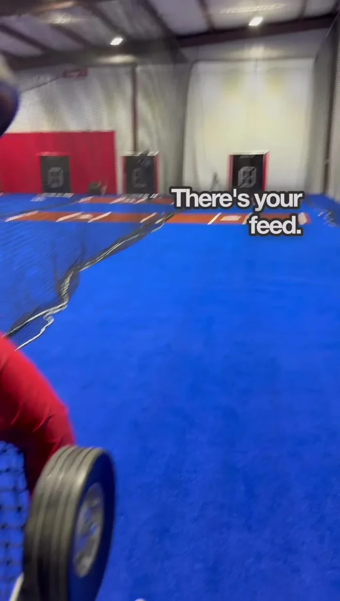 Adjust the top and bottom wheels to correct any ball hook (left or right). Add a click to the slower wheel or reduce power from the faster one to straighten the pitch.