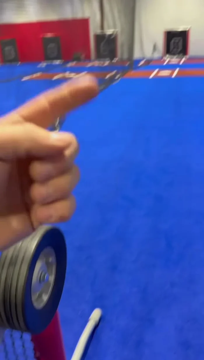 Adjust the top and bottom wheels to correct any ball hook (left or right). Add a click to the slower wheel or reduce power from the faster one to straighten the pitch.