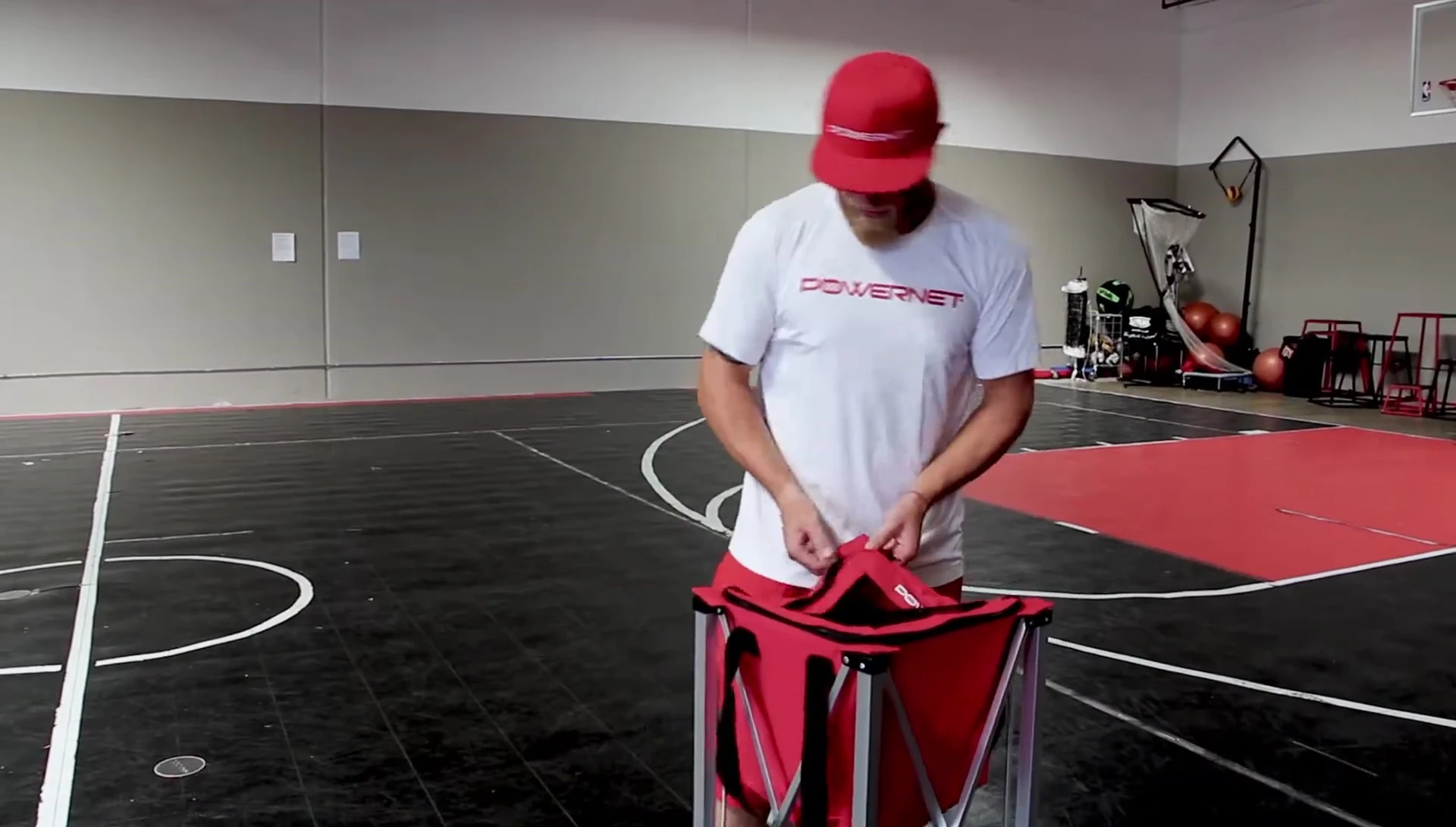 Demonstration of the caddy's spill-proof design; the caddy is flipped upside down showing no balls fall out.