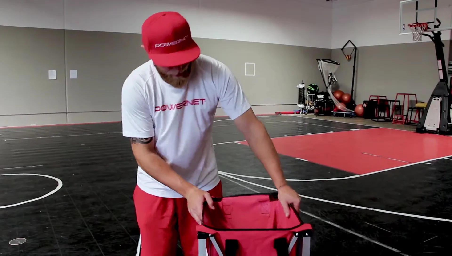 Close-up of the PowerNet Wheeled Ball Caddy being set up quickly and easily.