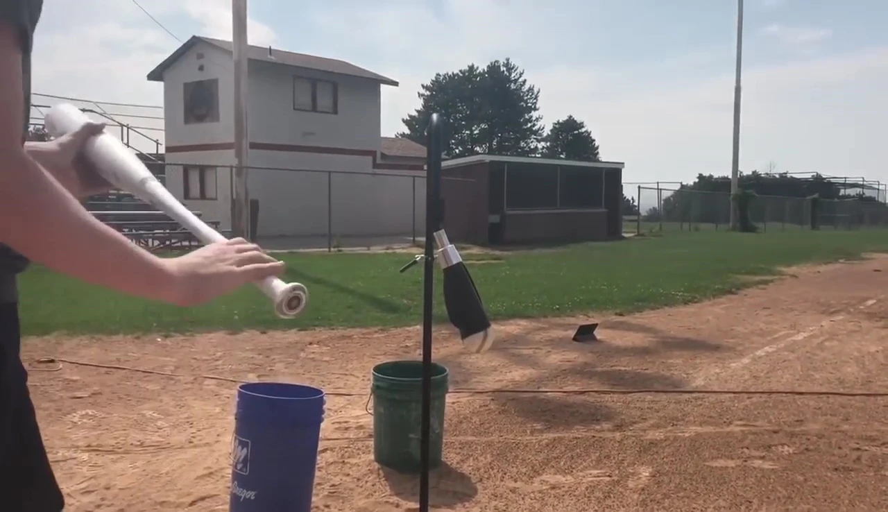 Demonstration of the BackSpin Tee's downward launch angle.