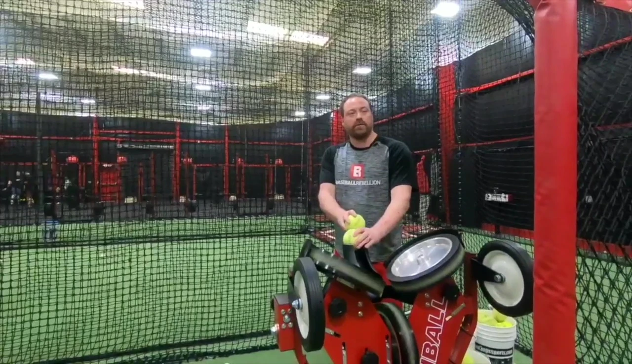 Coach demonstrating simulated change-up using the machine