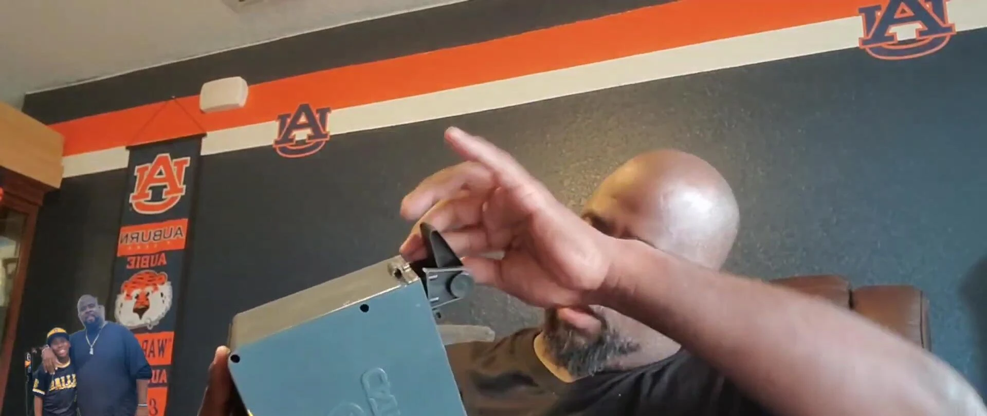 The reviewer assembling the base and legs of the machine.