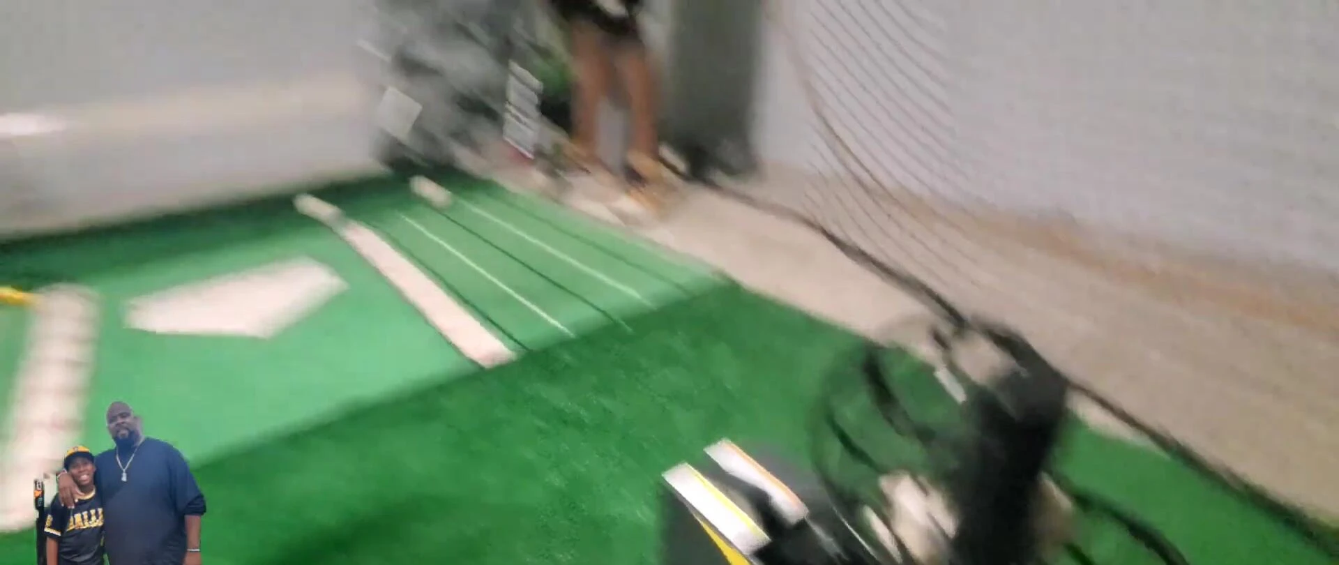 The machine in action, dispensing a baseball.