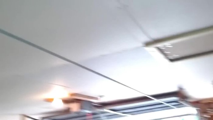 Bolt the eye hook securely into the wall joists, repeating on both ends.