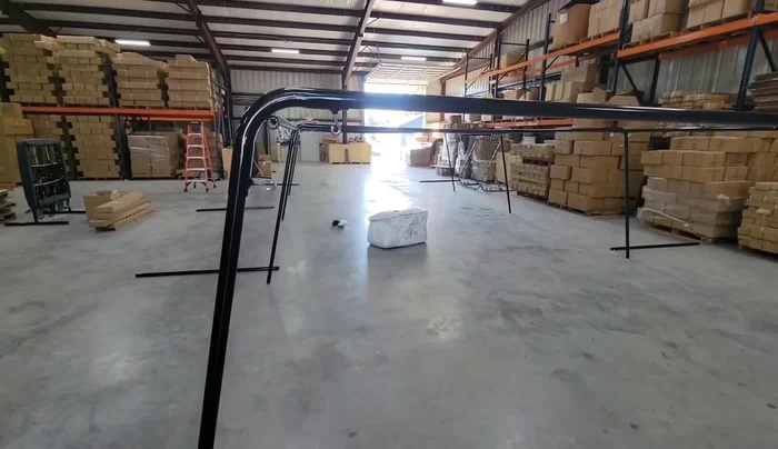 Tie the corner and center lead ropes to the frame fittings. Leave some slack; don't cinch completely. This allows the net to hang properly.