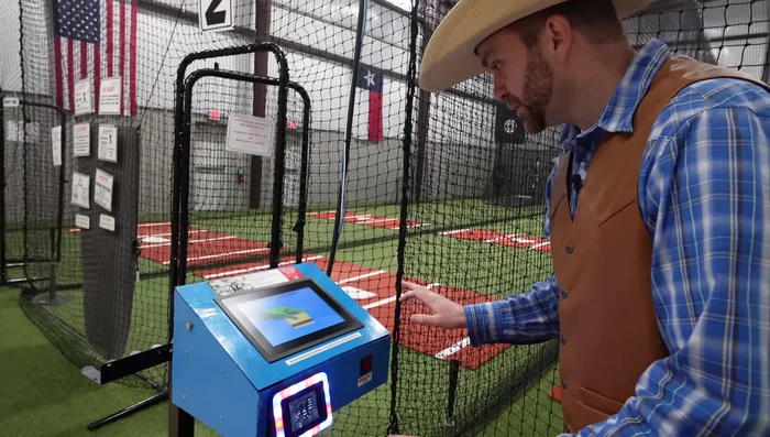 Select your desired settings on the machine (baseball/softball, speed, strike zone).