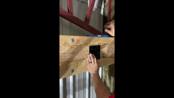 Attach the bracket to the header using lag screws and a ratchet.