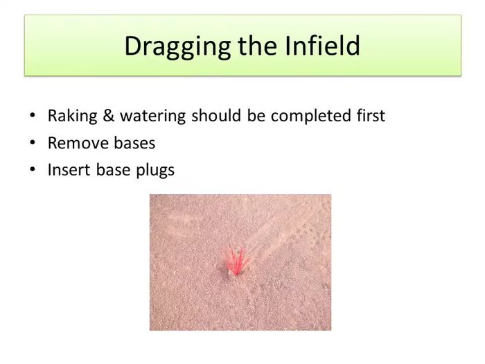Prepare the infield: Raking and watering must be completed before dragging.