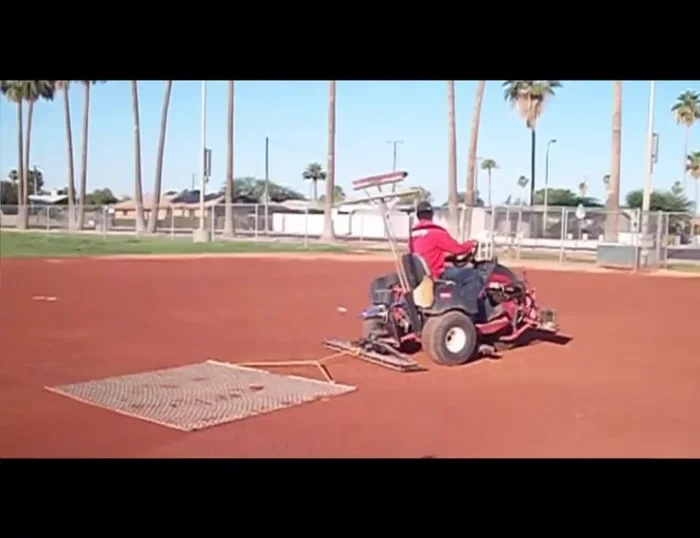 Finish and store: Shake off excess dirt, roll up the drag mat, and store it in the Gator's bed. Break out the area where dragging stopped to ensure a smooth finish. Alternate exit points to prevent hump formation.
